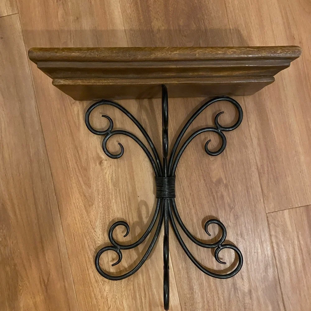 Brown and black iron and wood wall shelf